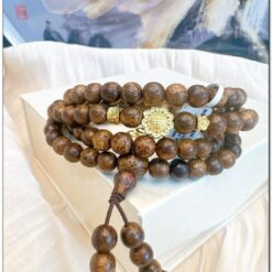 Chuỗi trầm hương 6li 108 hạt mix charm vàng và đá quý